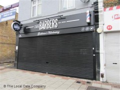 Til's Barbers image