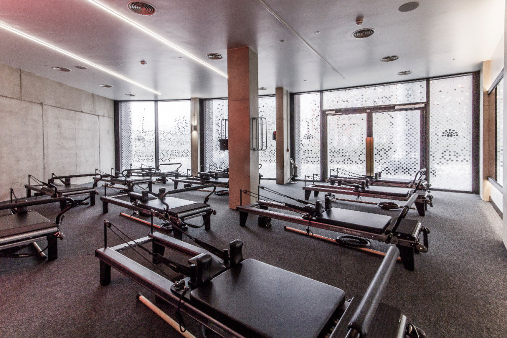 An open, airy reformer Pilates studio at Ten's King's Cross studio.