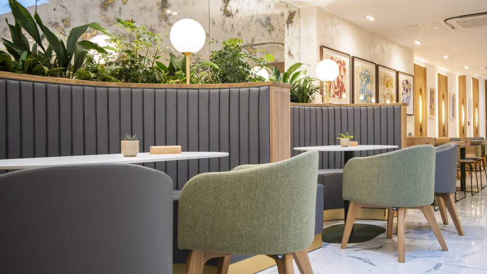 Banquette seating area towards the back of Demitasse London Coffee Shop in Wimbledon